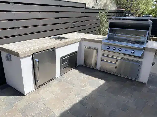 Modern outdoor BBQ grill station with closed storage