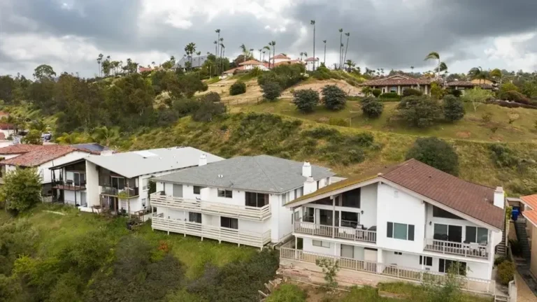 Residential hillside homes in Bonsall with scenic views of rolling hills and lush greenery.