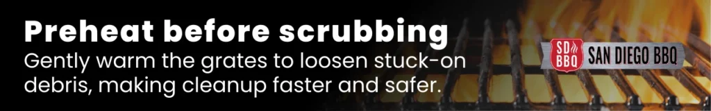 Expert tip advising gentle preheating of grill grates for easier debris removal and a safer cleanup.